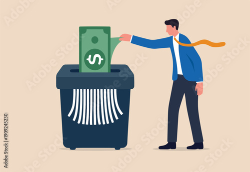 Money shred bad investment, scam or fraud causing losing money, mistake or financial failure spending concept, businessman hand feed banknote money into shredder to destroy losing all his wealth.