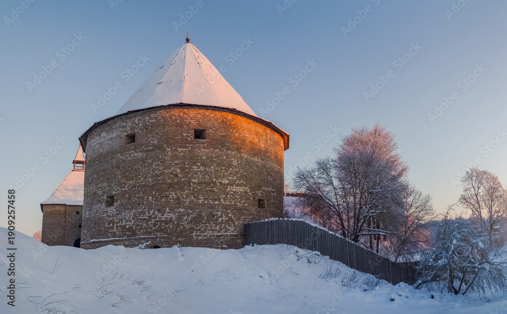 Fototapeta premium A large tower with a snow covered roof.