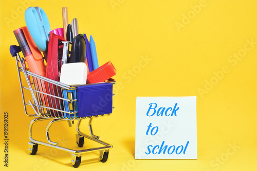 Close up, shopping cart, various school supplies back to school.