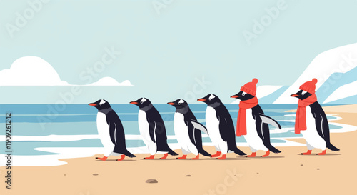 A line of penguins walks along a beach by the ocean in winter