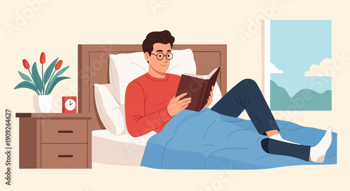 A man in bed wearing glasses reads a book comfortably under a blue blanket