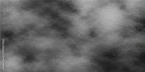 Dark black and white smoke clouds forming an abstract and moody background in the sky