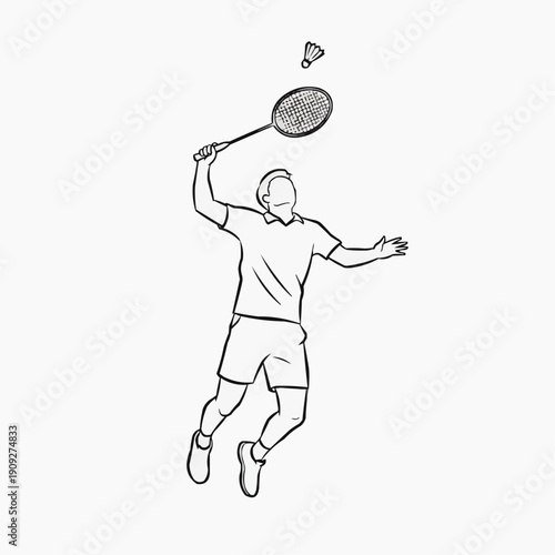 Male player hitting a shuttlecock during badminton game action  