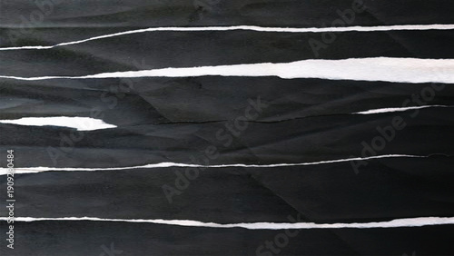 Torn black and white paper texture background with ripped edges and grunge pattern