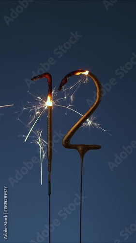 Wallpaper Mural 12 years celebration festive vertical footage made with Bengal fires in the form of number Twelve. Torontodigital.ca