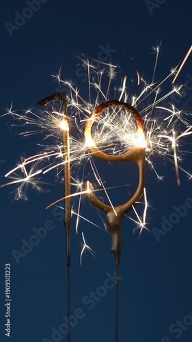 Wallpaper Mural 19 years celebration festive vertical footage made with Bengal fires in the form of number Nineteen. Torontodigital.ca