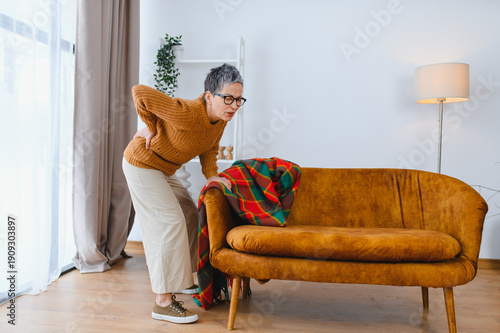 Fényképezés Senior woman feeling severe back pain at home