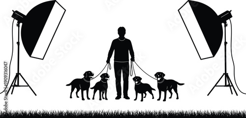 Dog walker silhouette holding multiple dogs on leashes between studio lights, representing pet care, animal training, professional photography setup, and modern lifestyle concept