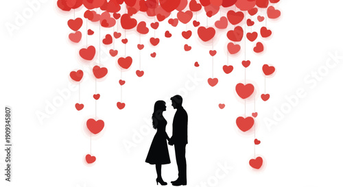 Silhouetted couple embracing under a cascade of red hearts