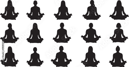 Silhouettes of people meditating in lotus position together