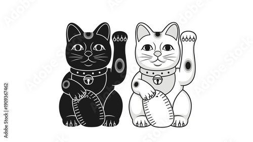 Two traditional Japanese beckoning cats known as maneki-neko in black and white colors for good luck and fortune.