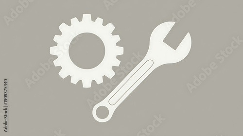 A white wrench and a white gear are shown on a gray background