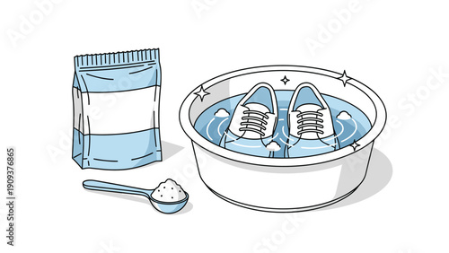 White and blue sneakers soaking in a basin of water with detergent powder for cleaning and laundry care on a plain background.