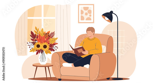 Man Reading Book in Armchair Next to Autumn Flowers