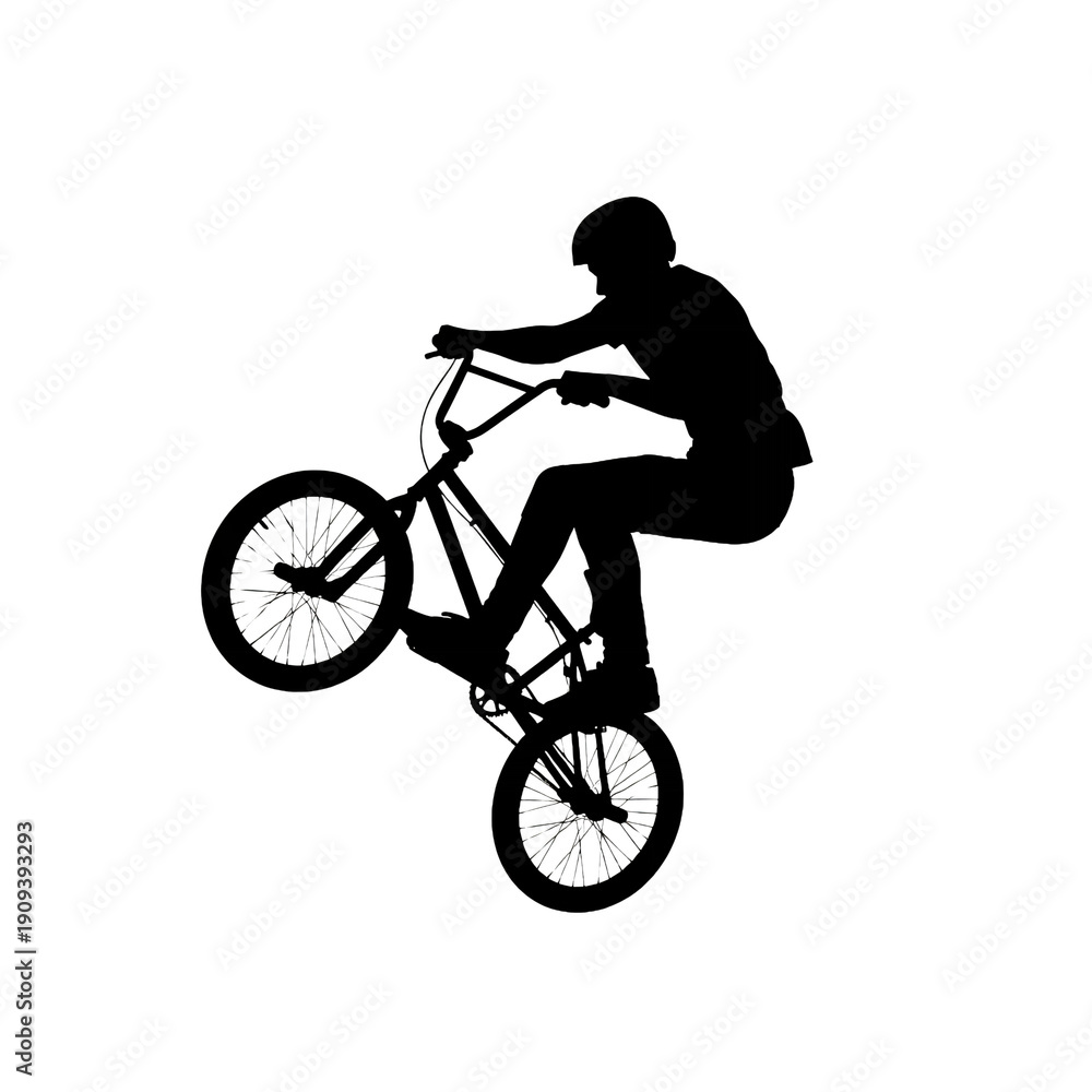 Naklejka premium Silhouette of a BMX rider performing a trick on a bicycle, capturing extreme sports and action