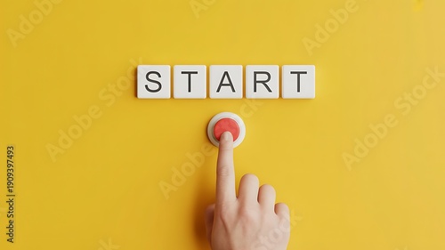 A finger pressing a button with the word start on it, surrounded by tiles.