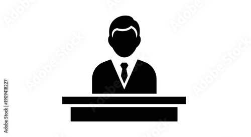 Businessman standing behind desk.