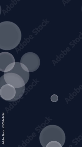 motion none Vertical Bokeh effect with gray circles on dark background