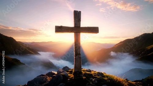 Sunbeams Burst Through Wooden Cross on Misty Mountain Peak