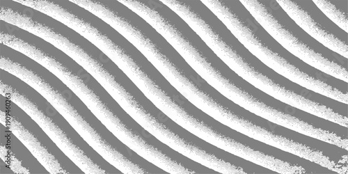 A macro close up shot of a textured white sand background featuring fine lines and a material design that resembles the industrial surface of gray metal or steel