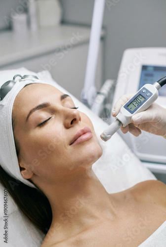 Wallpaper Mural Localized cryotherapy facial treatment with vapor wand displaying negative temperature for skin rejuvenation and pore tightening. Torontodigital.ca