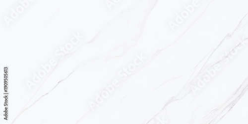 An abstract white paint and milk splash creates a frozen winter texture with blue frost patterns on a cold marble surface like a snowy landscape under a light sky