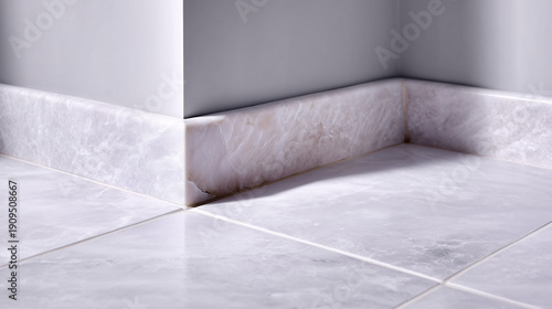 Interior corner with ceramic floor tile and baseboard. Focus on floor finish and tile joint detail.