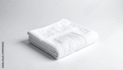 Clean White Folded Towel on White Background for Hygiene.