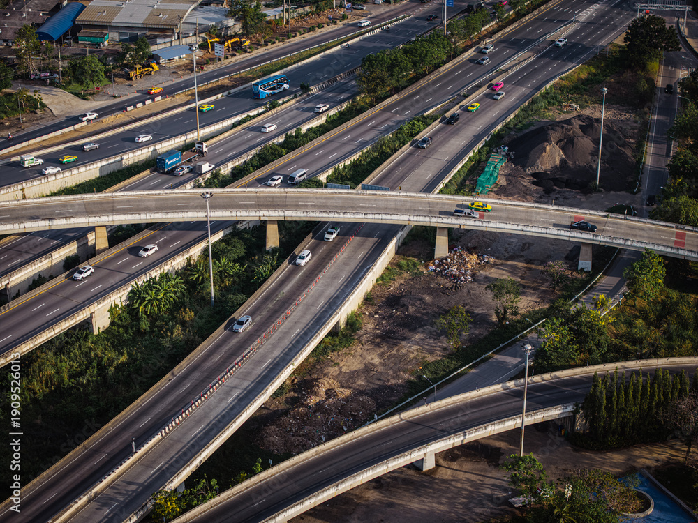Obraz premium Aerial view modern city asphalt transport junction x cross road with vehicle movement