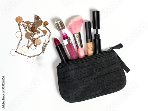 Small textile open bag with makeup and other beauty accessories 