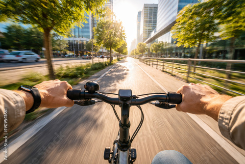 Rider's perspective of cycling through a sunny city street