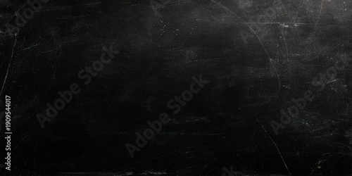 Scratched dark surface with white marks and scratches