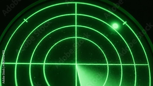 Glowing green radar screen scan display with moving sweep and signal blip