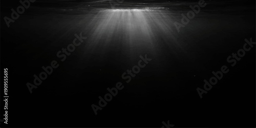 A bright vintage spotlight illuminates an empty dark stage, casting textured light onto an old brushed metal wall with a grunge steel pattern in this grey industrial art space