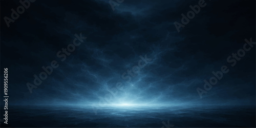 A dramatic dark blue sky filled with stormy clouds and a hint of light creates an abstract nature background capturing the powerful atmosphere of a night heaven