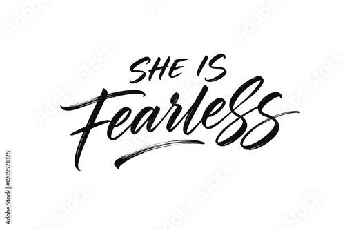 Handwritten calligraphy phrase "She is Fearless" in black ink