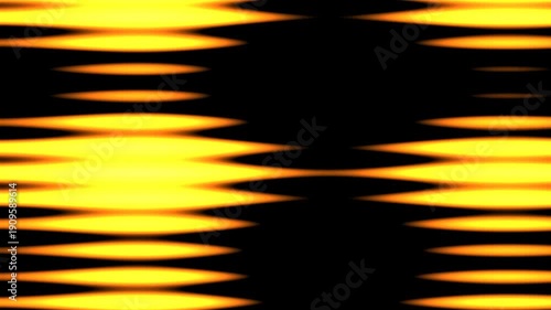 Vibrant yellow and orange stripes moving rapidly across a black background, creating a dynamic and energetic visual effect from a straight-on viewpoint.