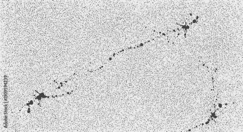 Dynamic black ink splatters on textured white background