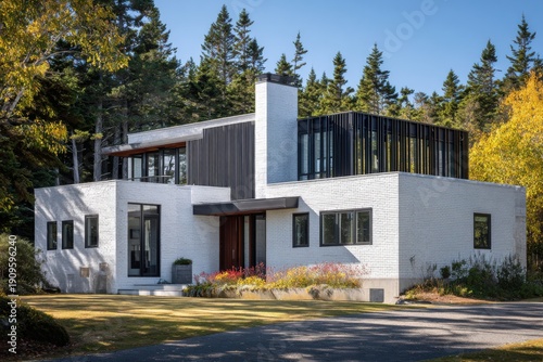 Modern house design showcases a blend of natural surroundings and contemporary architecture in a forest setting during daylight