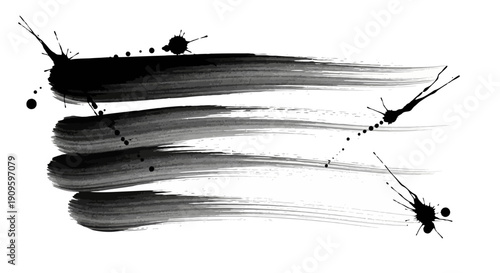 Dynamic black brush strokes on white background with splatters