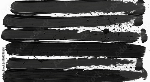 Bold black paint strokes on white background for creative design
