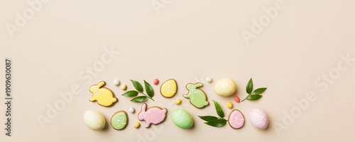 Wallpaper Mural holiday preparation Multi colors Easter eggs with cookies on colored background . Pastel color Easter eggs. holiday concept with copy space Torontodigital.ca