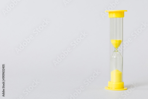 hourglass on the table, sand clock as time passing concept for business deadline, copy space