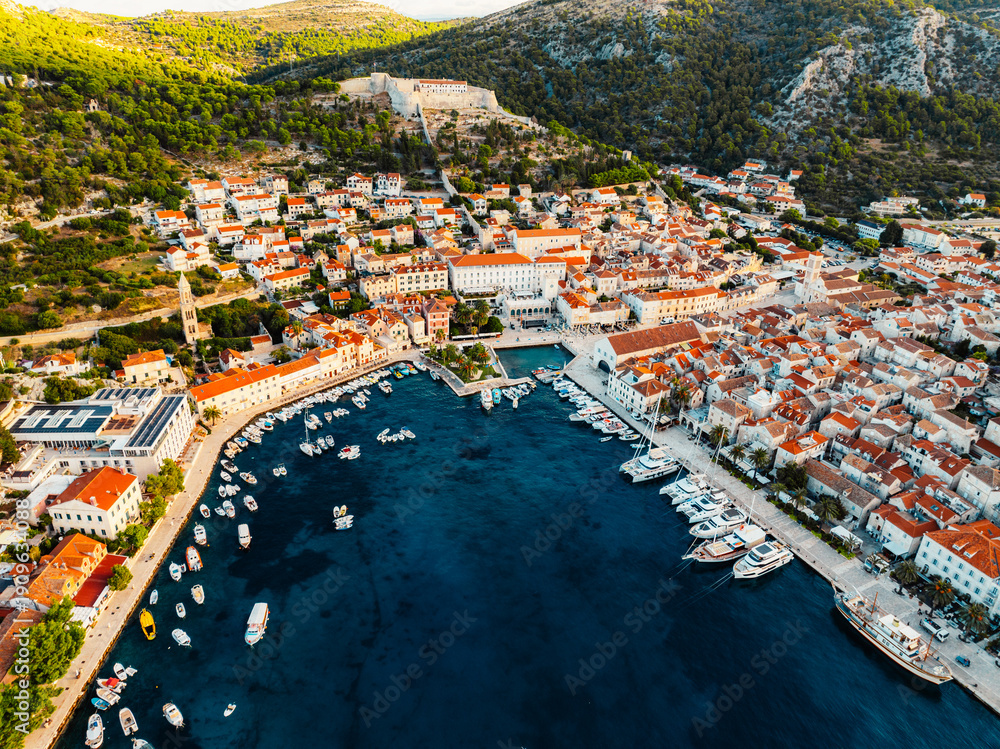 Fototapeta premium Aerial view of the historic Hvar town and the Spanish Fortress (Fortica) overlooking the harbor and Adriatic sea, Hvar island, Dalmatia, Croatia.