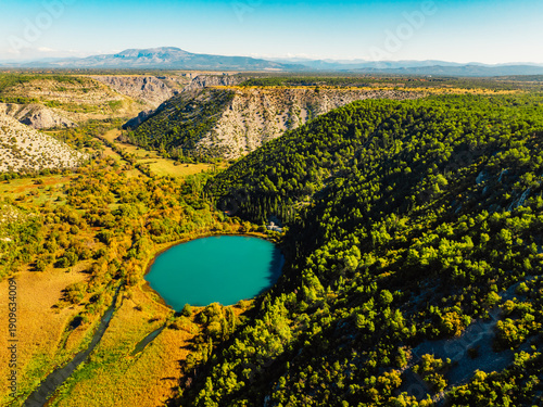 Obraz na plátně Aerial view of the confluence where the Cikola river lake drom torak view tributary joins the Krka river canyon, Krka National Park, Dalmatia, Croatia