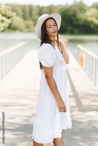 Wallpaper Mural Woman In White Dress On Lakeside Bridge. Summer Fashion And Tranquil Scenery. Torontodigital.ca