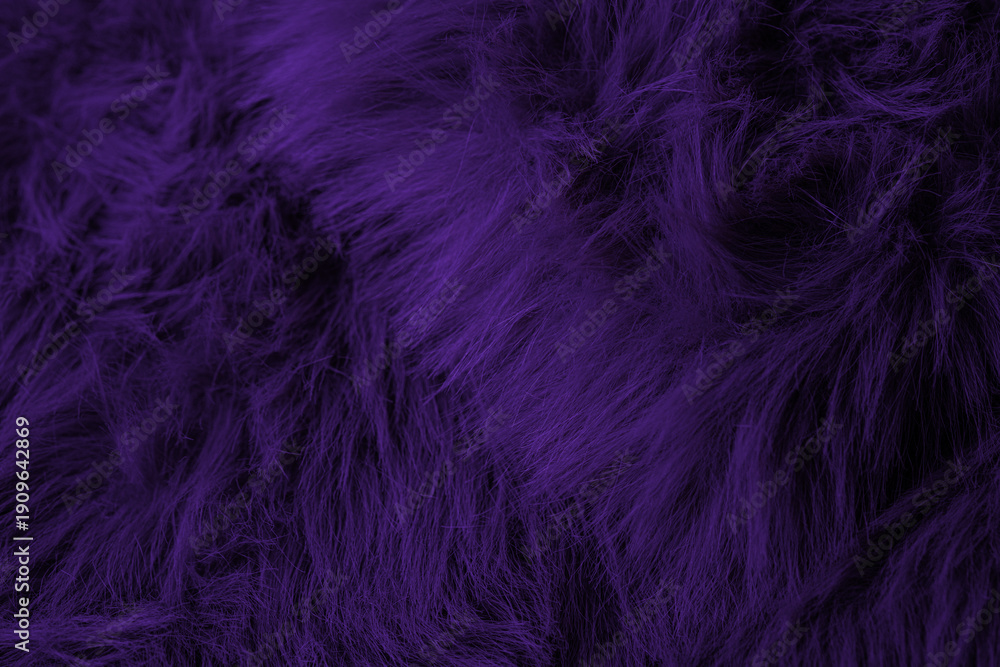 Obraz premium Vibrant dark purple shaggy faux fur plush fabric creating a luxurious soft textile background pattern