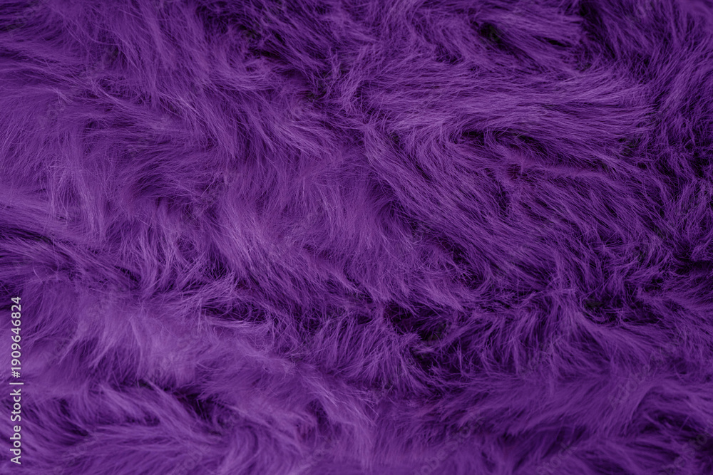 Fototapeta premium Vibrant deep purple plush faux fur texture creating a luxurious soft fluffy abstract background material design