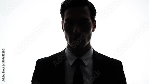 Wallpaper Mural Silhouette of a man in a suit against a bright white background Torontodigital.ca