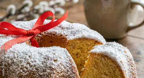 Traditional Easter Bundt Cake with Powdered Sugar and Red Ribbon